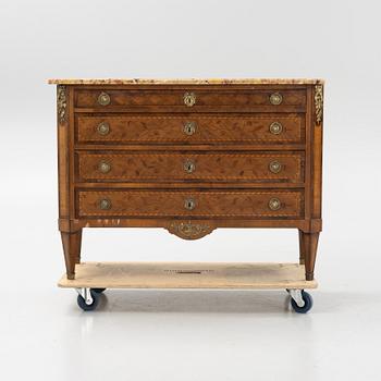 A Louis XVI-style marquetry and marble commode, later part of the 19th century.