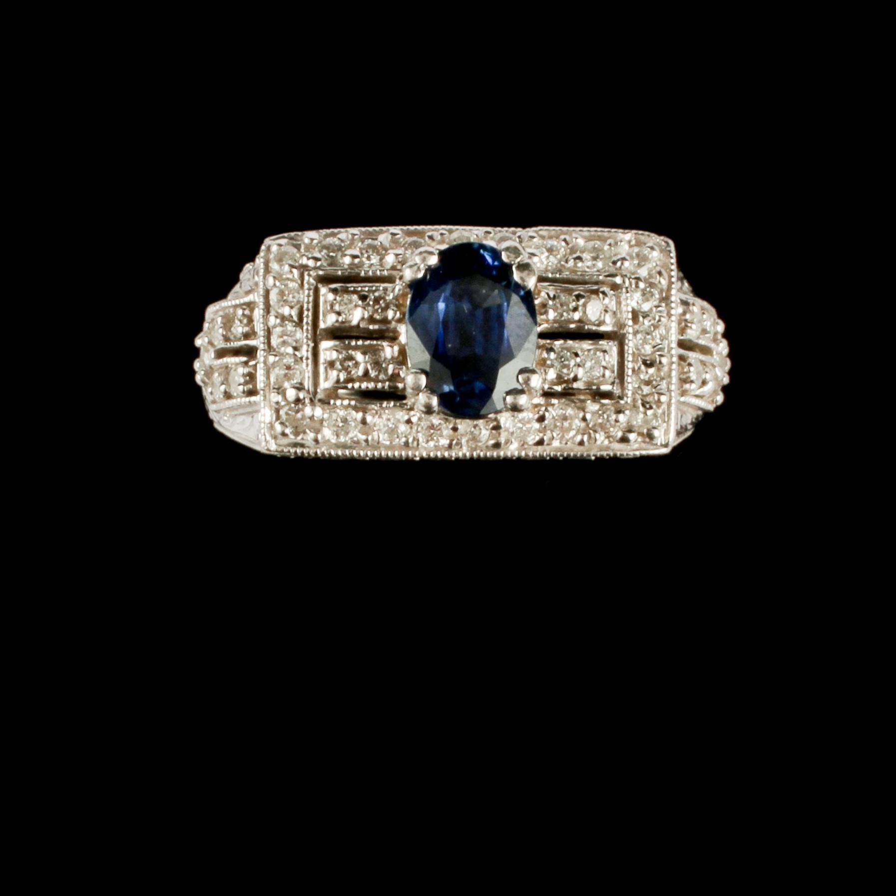 RING, 14k vitguld med små briljantslipade diamanter samt fasettslipad blå safir, utländska stämplar. Vikt 8 g.