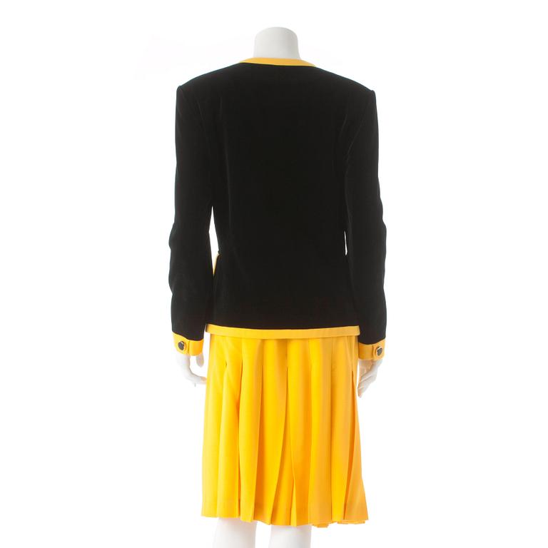 ESCADA, a two-piece black velvet and yellow dress consisting of jacket and skirt.