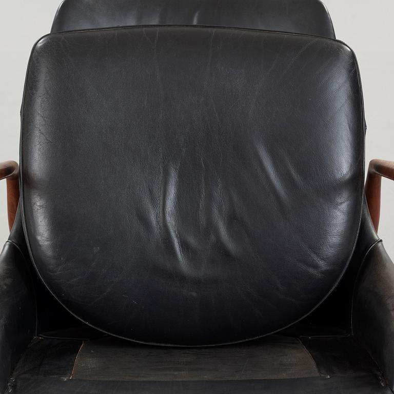 Ib Kofod-Larsen, a 'Seal' teak and black leather armchair, Olof Persson Möbler, Jönköping, Sweden 1950's-60's.