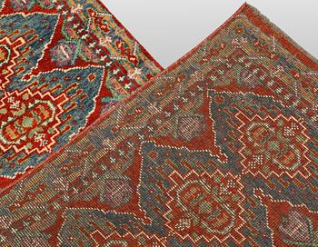 An oriental runner, c. 386 x 78 cm.