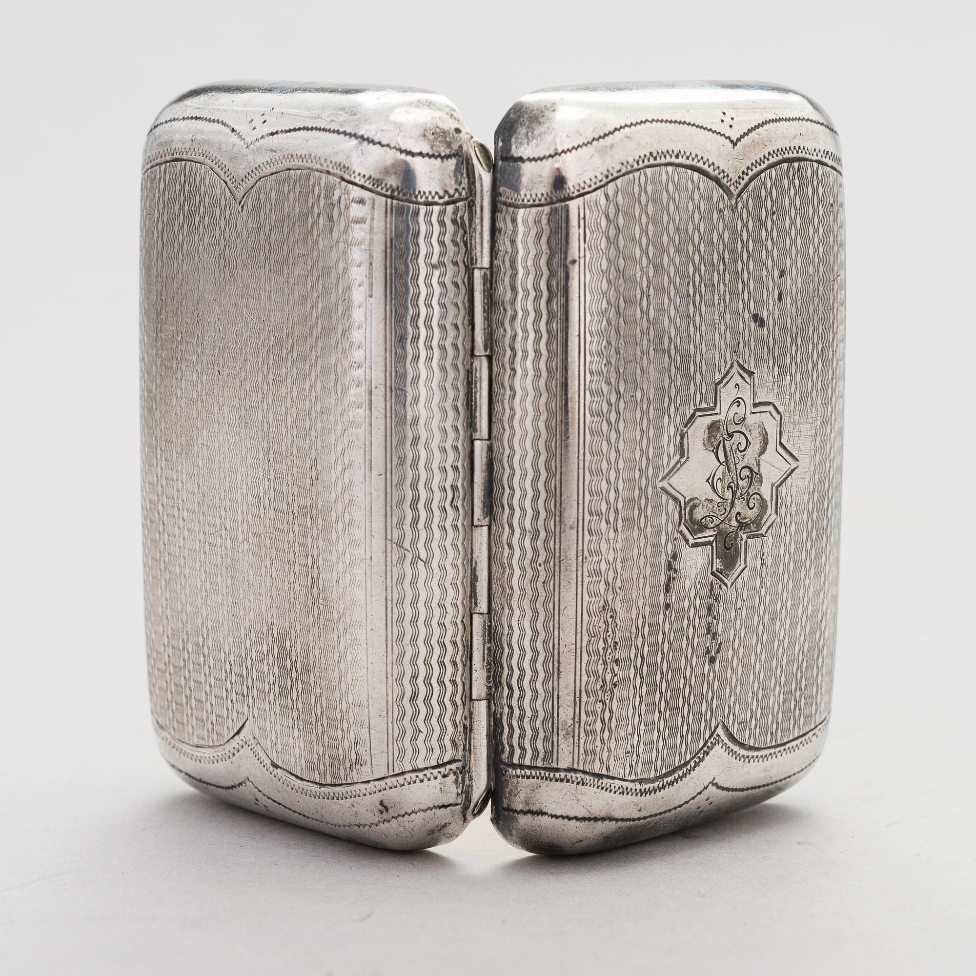 A Russian, parcel-gilt silver cigarette case, maker's mark of Karl Verlin, Saint Petersburg 1871-1878.