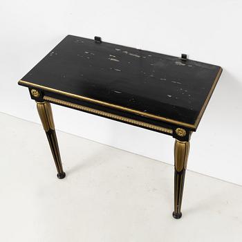 An Empire mirror by Jonas Frisk (Stockholm 1805-1824), and a later console table.