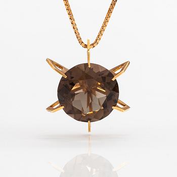 A 14K gold necklace with a smoky quartz. Martti Tapio Aarnio, Helsinki 1966.