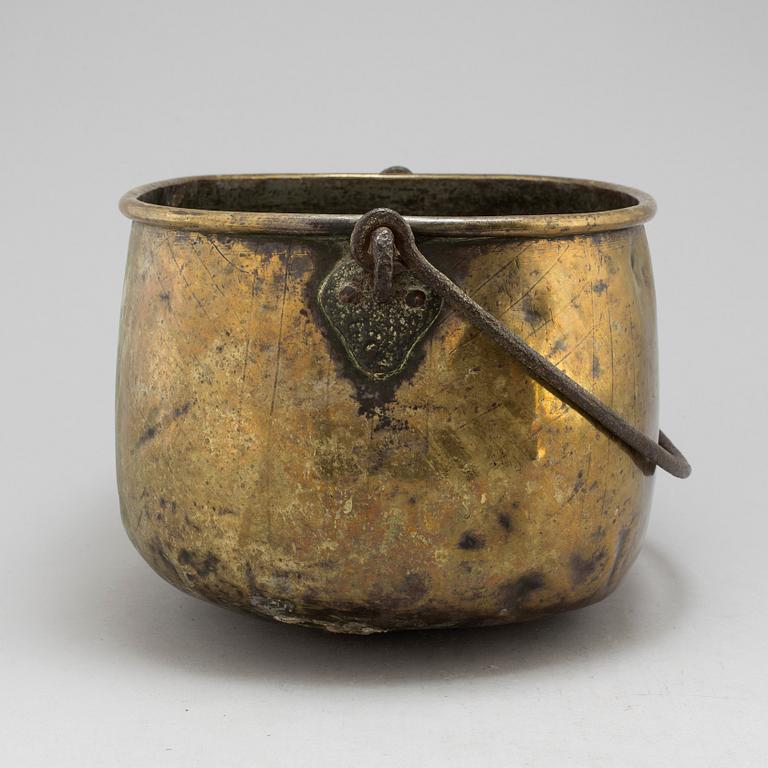 An 18th century brass cauldron.