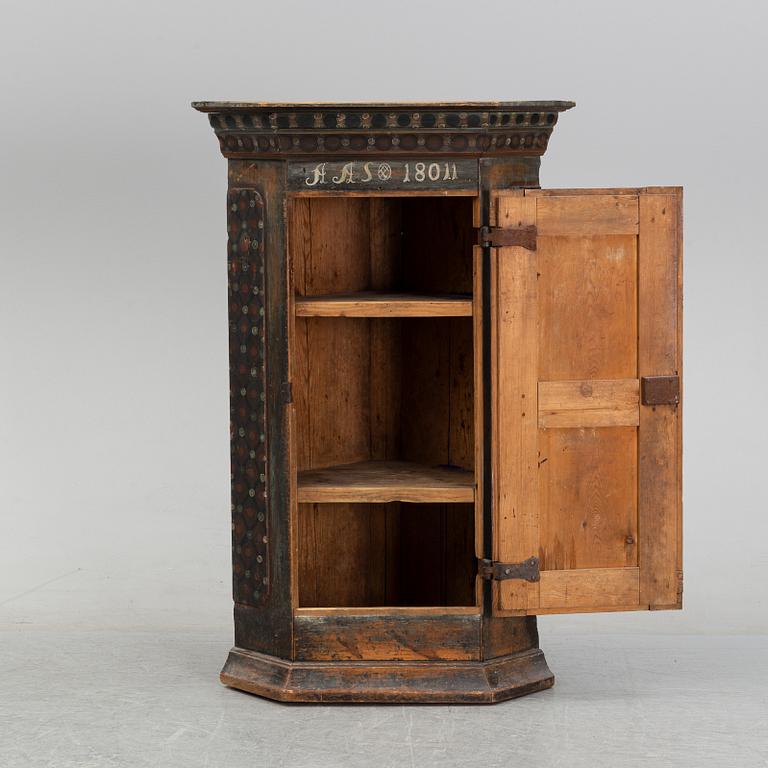 A painted corner cabinet, 19th Century.