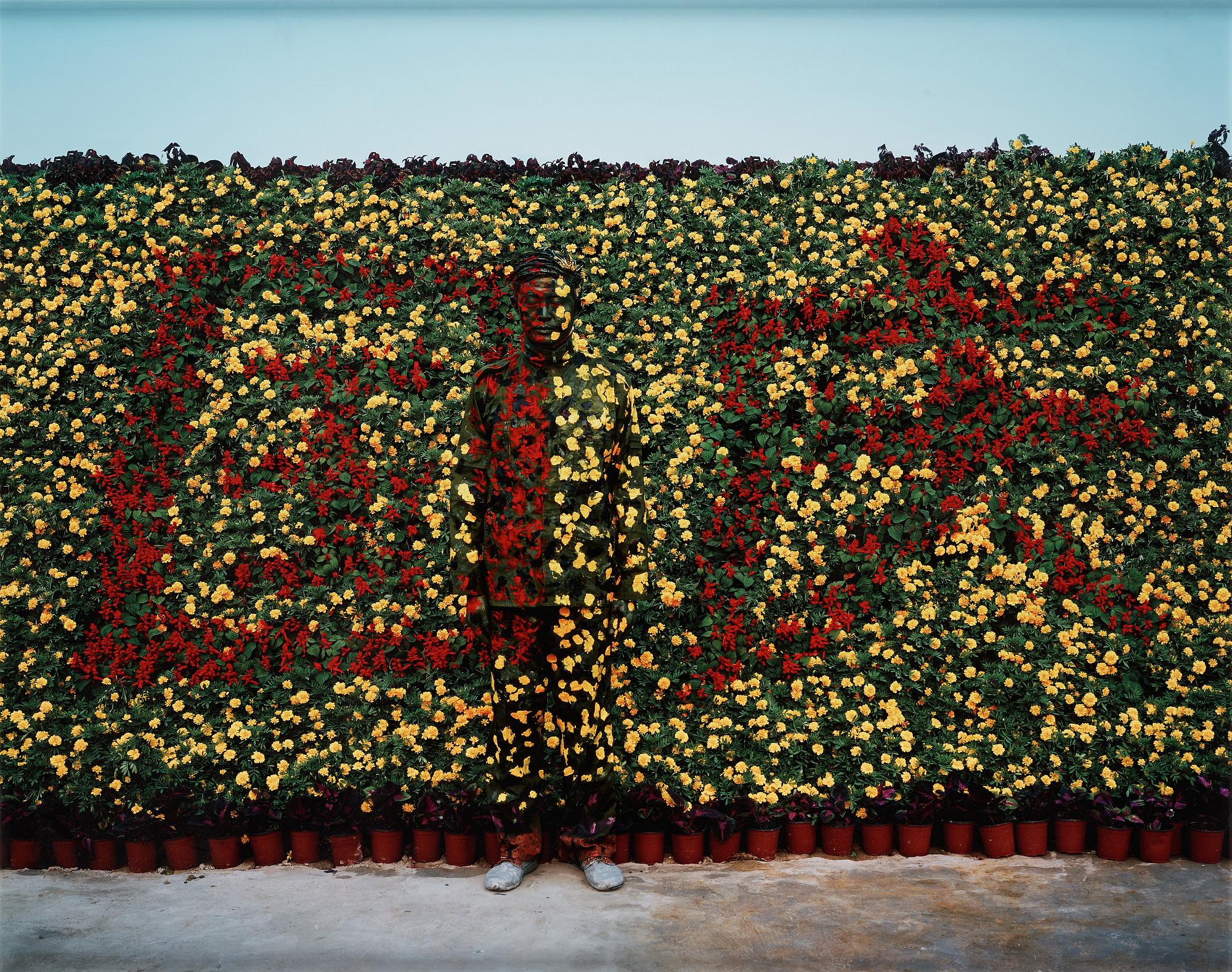 Liu Bolin, "Hiding in the City No.90 – National Day", 2010.