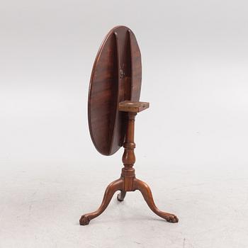 A tilt-top table, 19th century.