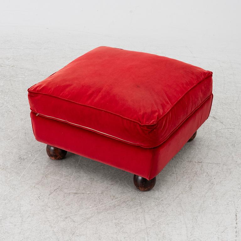 A pair of Howard-style armchairs and a footstool, late 20th century.