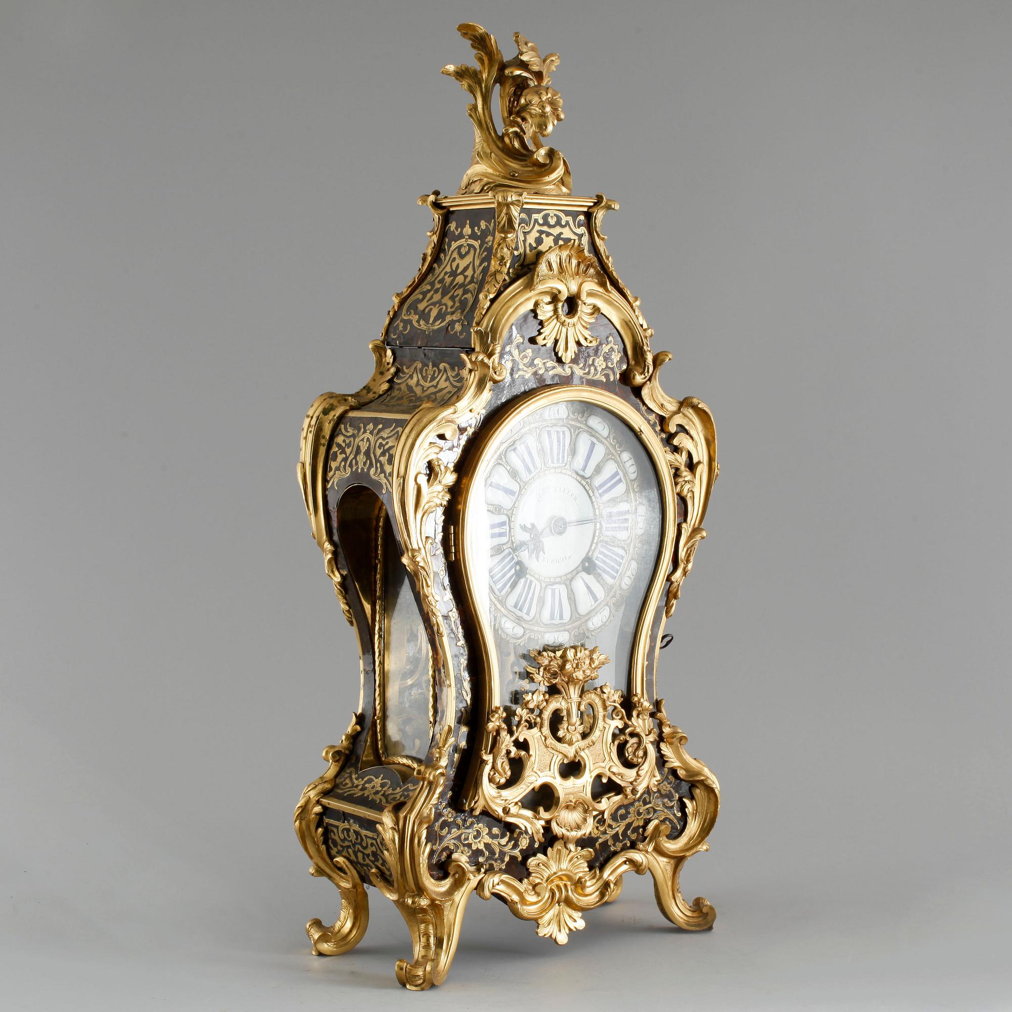 A 19th century mantle clock in the style of Louis XV.
