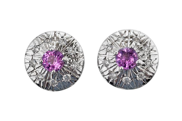 A PAIR OF DIAMOND EARRINGS.