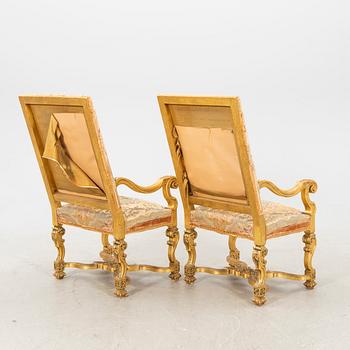 A pair of gilded Baroque style armchairs first half of the 20th century.