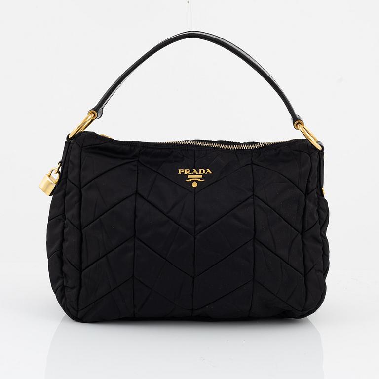 Prada, a black nylon bag.
