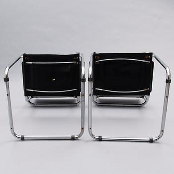 A Set of Three Chrome and Black Leather Chairs.