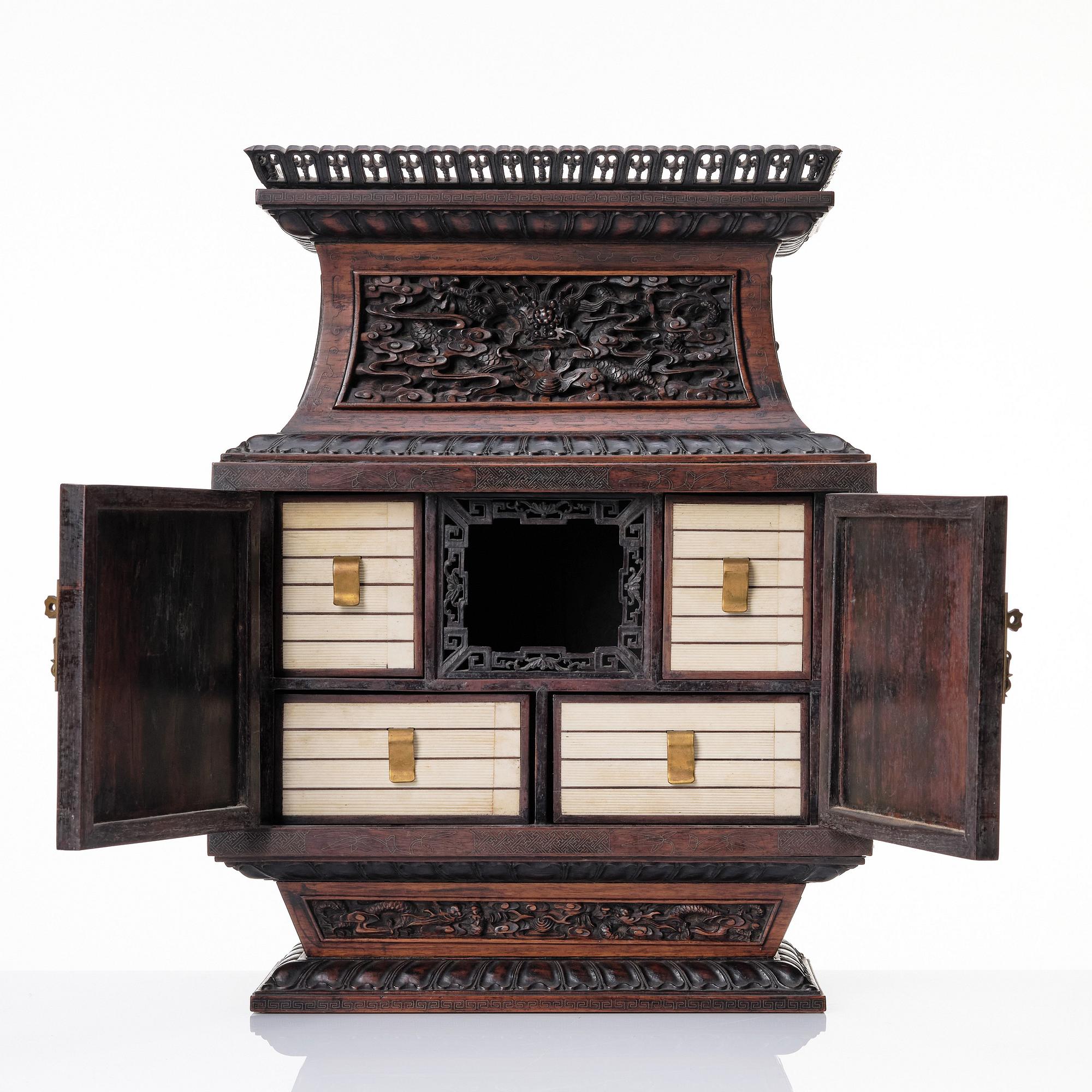 A hardwood dragon cabinet, Qing dynasty 18/19th Century.