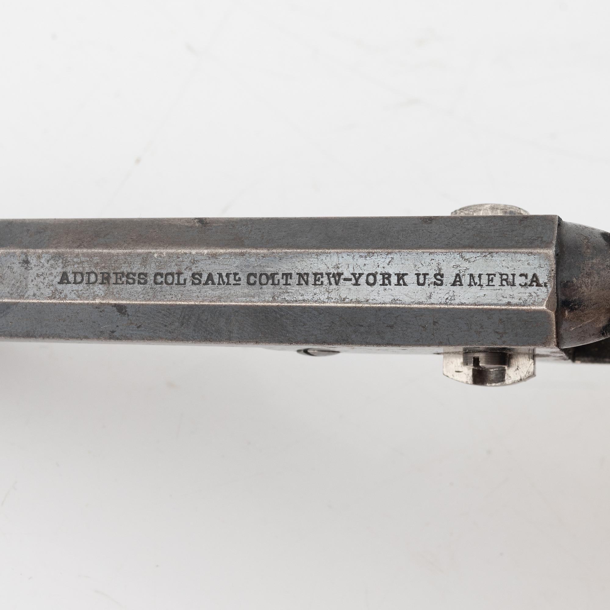 A Colt 1849 Pocket Revolver.