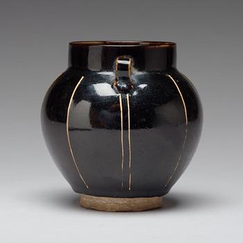 A Henan black glazed ribbed jar, Song dynasty (960-1279).