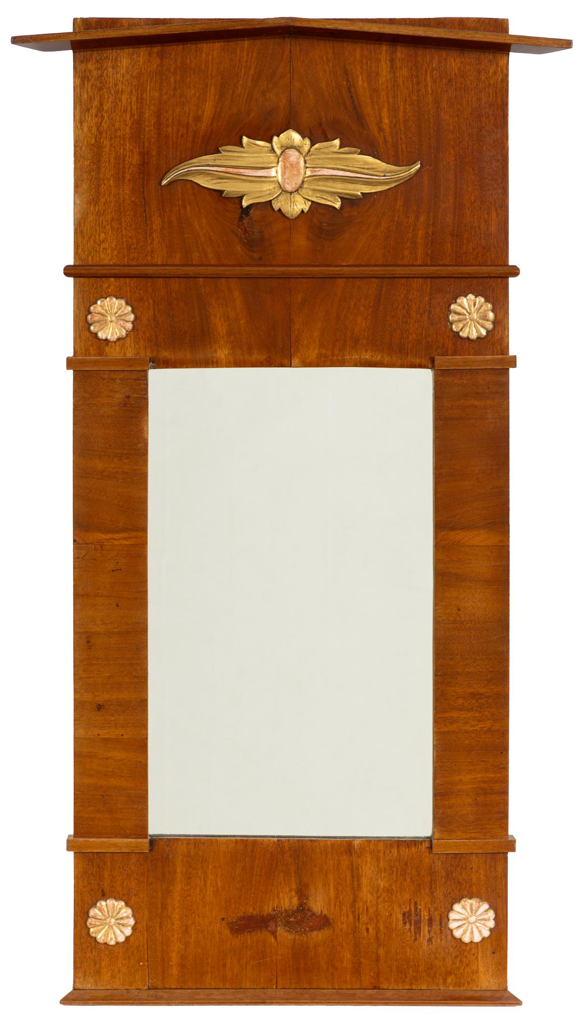 An Empire mahogany mirror, 19th Century.