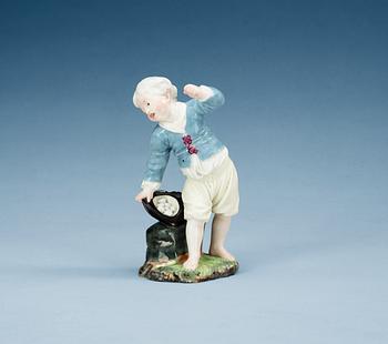 An Höchst figurine of a boy with eggs, presumably second half of 18th Century.