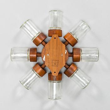 A Danish 1960s wall mounted spice rack in teak and glass from Digsmed.