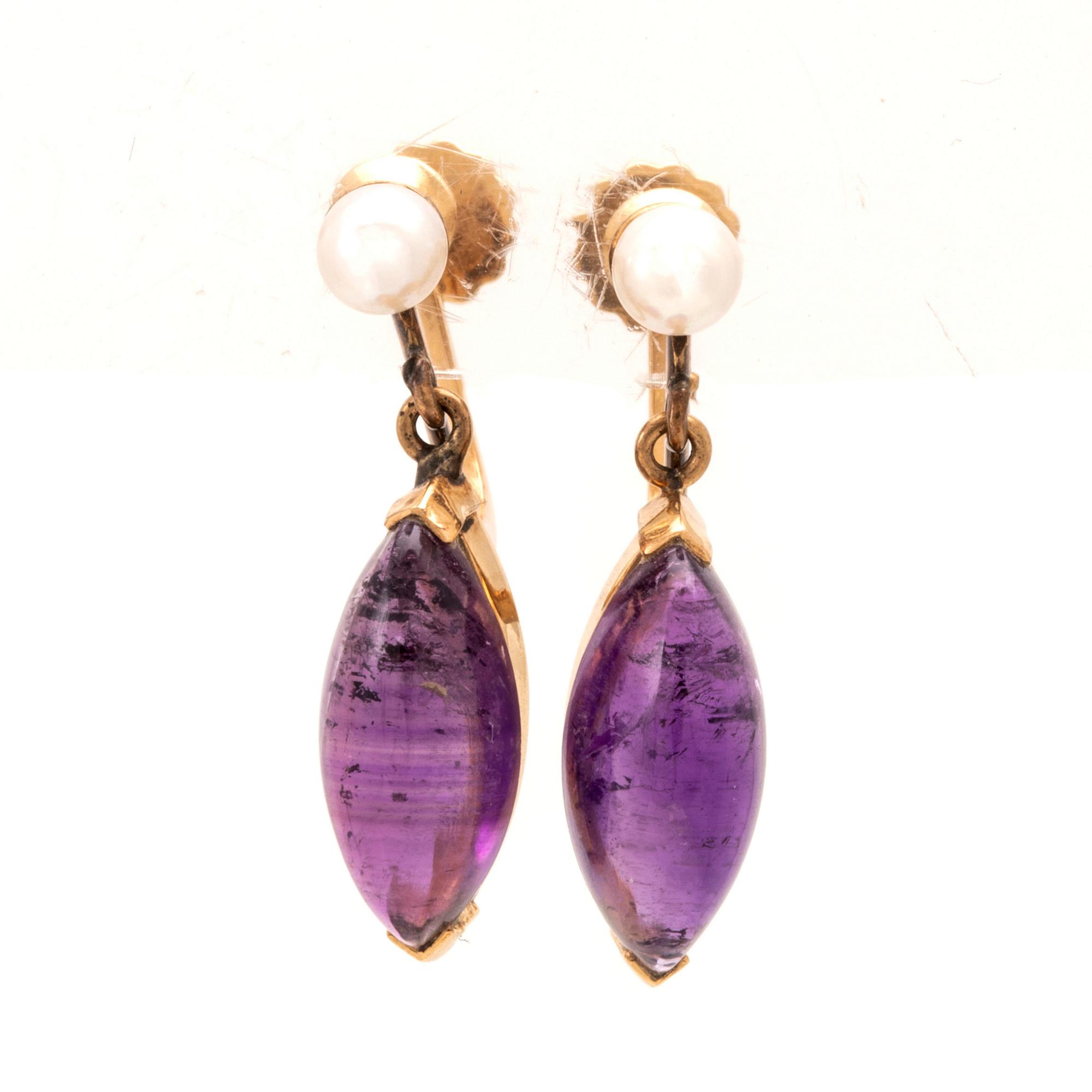 A pair of 18K gold earrings set with cabochon-cut amethysts and seed pearls, Stockholm 1961.