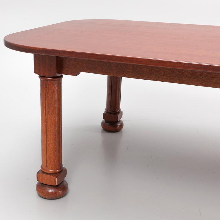 A mahogany and oak dining table, second half of the 20th century.