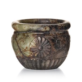 A well sculptured 'chrysanthemum' stone flowerpot, late Ming/early Qing dynasty.