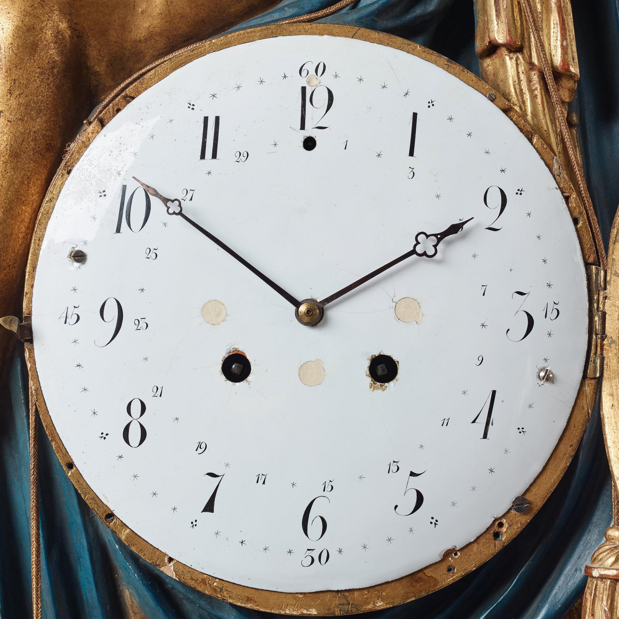 A Swedish Empire early 19th century gilt wood wall clock.