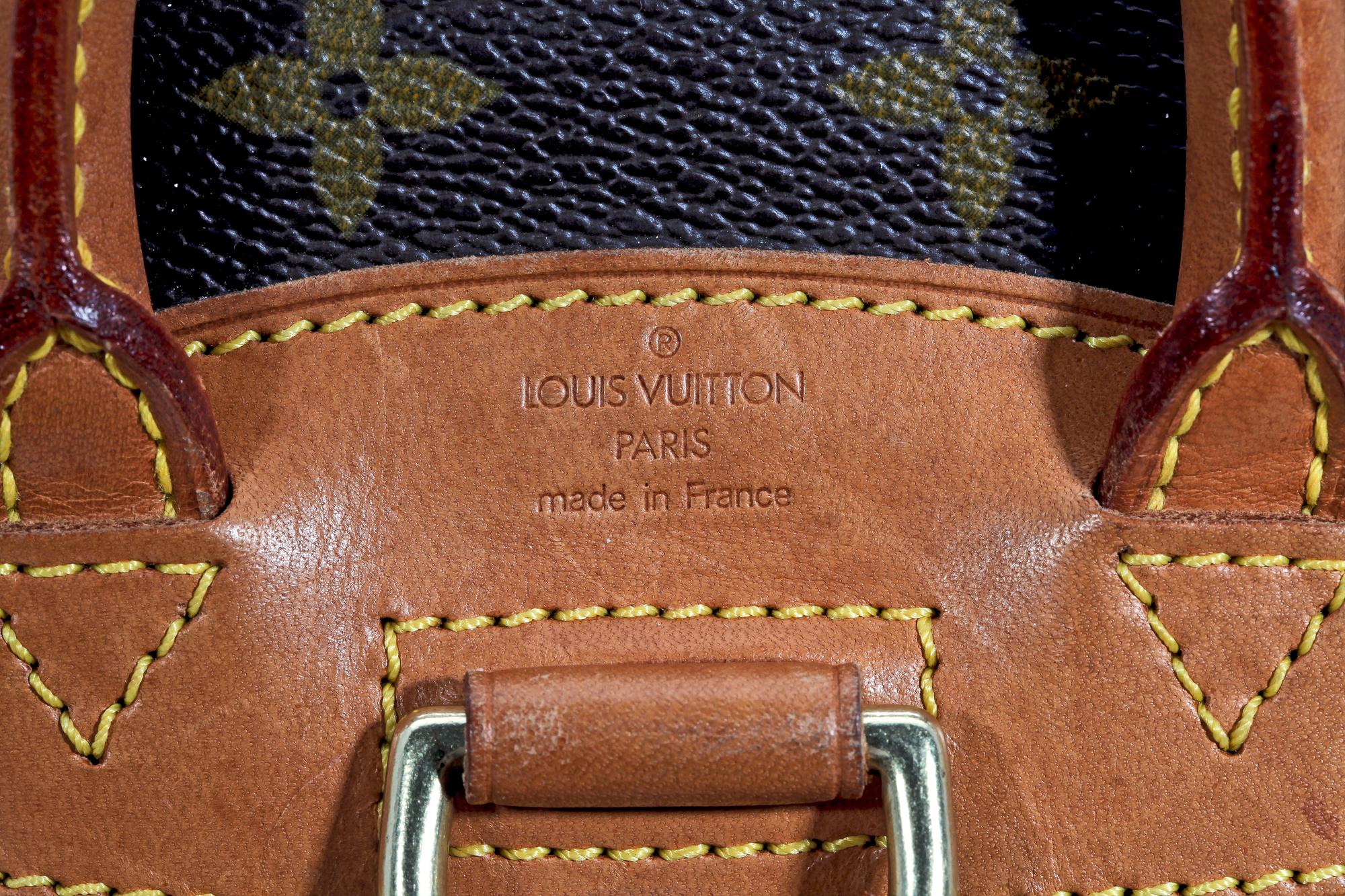 A monogram canvas back-pack by Louis Vuitton.