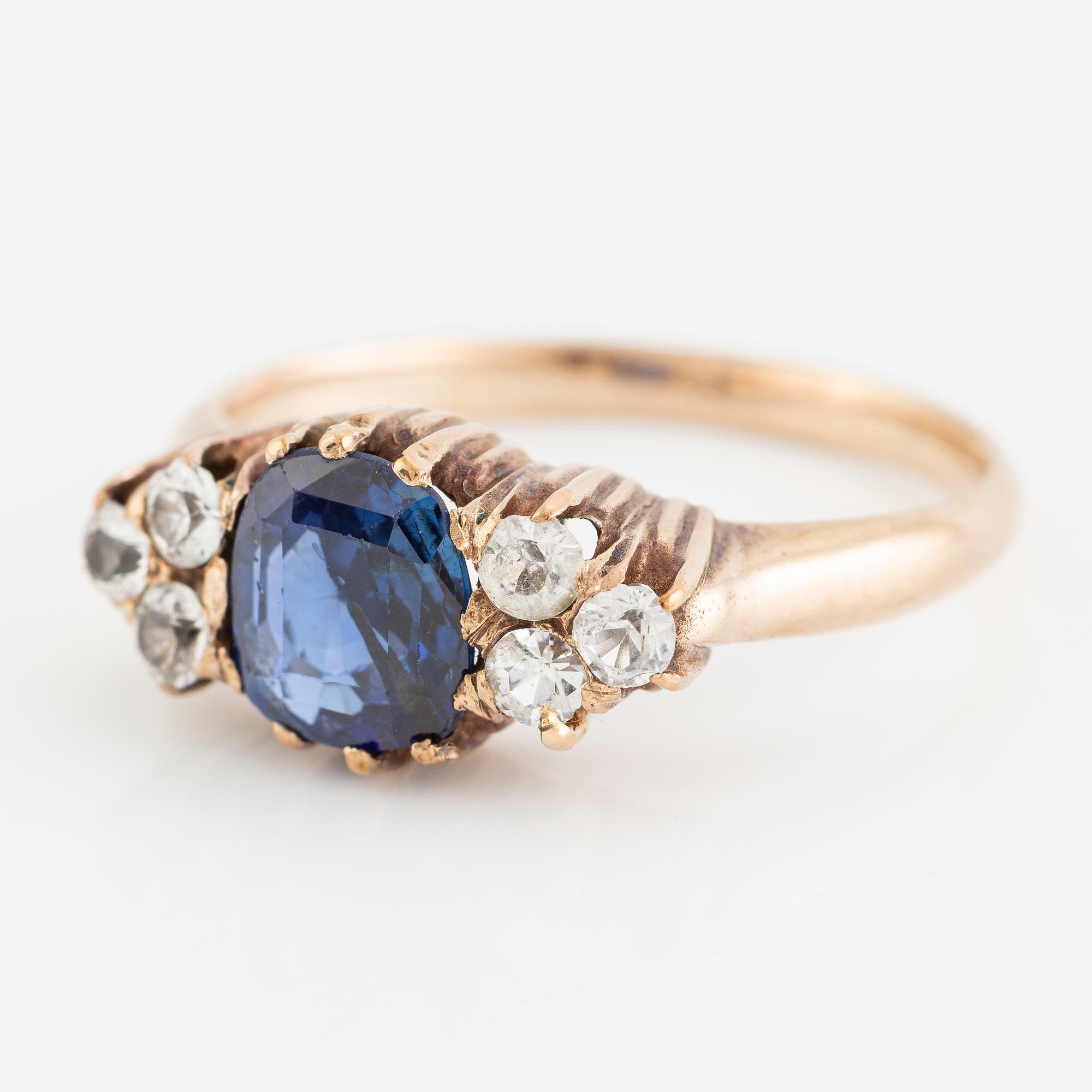Ring, 14K gold with blue sapphire and white stones.