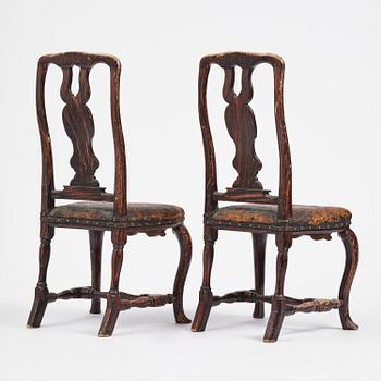 A pair of late baroque faux bois-painted chairs, attributed to M. Meling, 1730/40's.