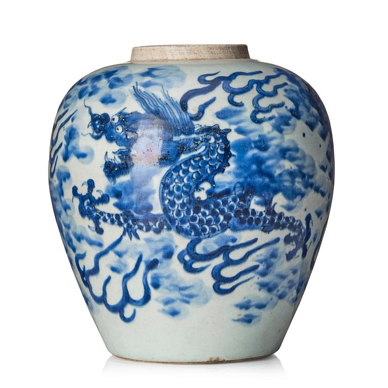 A blue and white Transitional jar with a four clawed dragon, 17th Century.