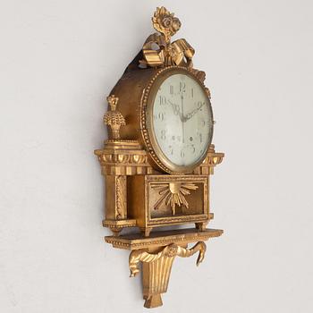 A Gustavian wall clock, late 18th century.