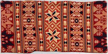 A carriage cushion, flat weave, ca 47-49,5 x 100 cm, Scania, Sweden, around 1900.