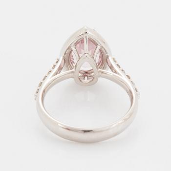 An 18K gold ring set with a faceted morganite.