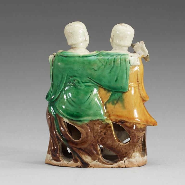 A figure of 'laughing boys', Qing dynasty, 18th Century.