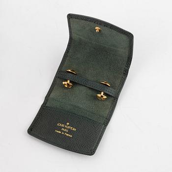Louis Vuitton, a pair of cufflinks in a taiga case.