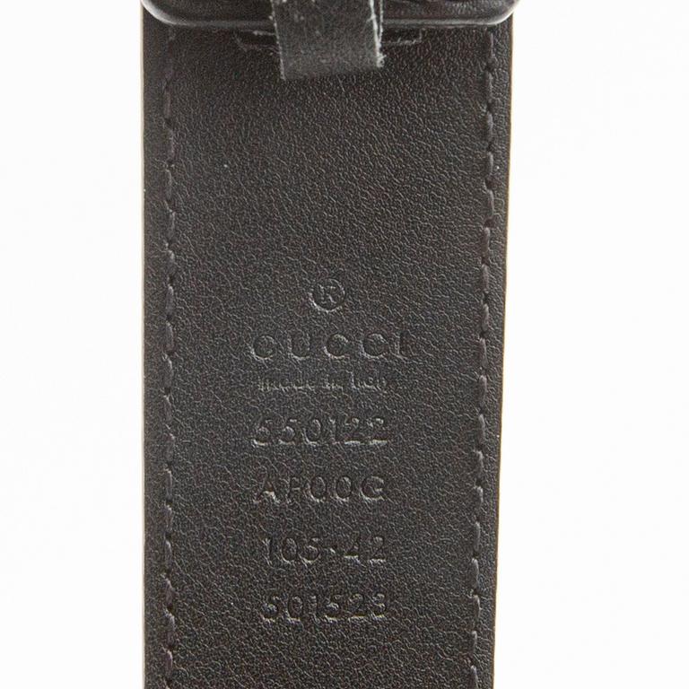 Gucci, belt and shawl.