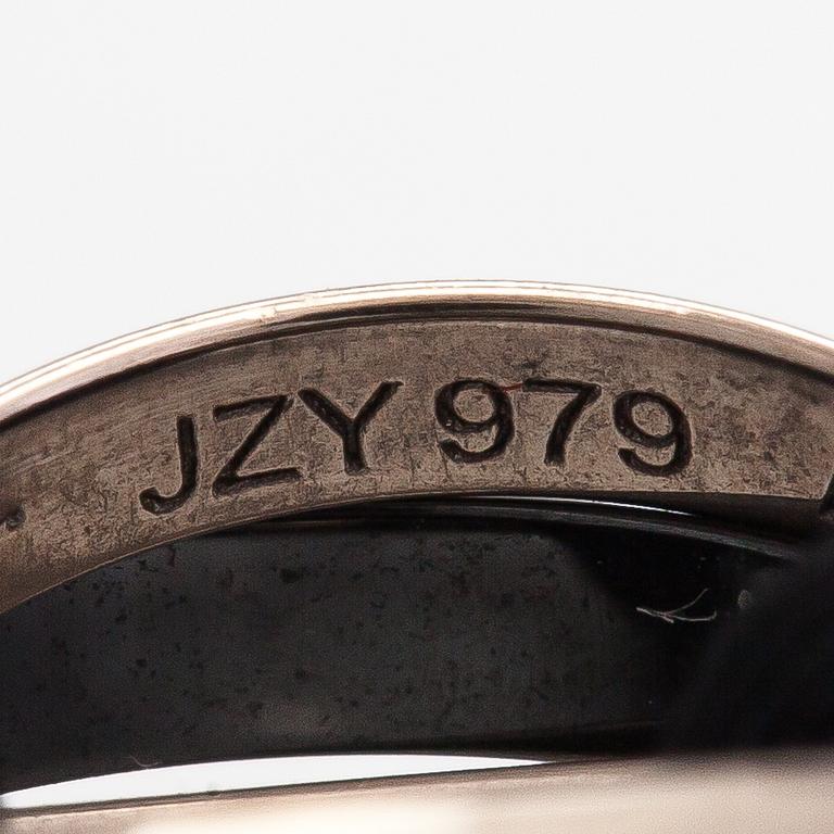 Cartier, A "Trinity" bracelet made of 18K white gold, ceramic and textile. Marked Cartier, JZY979.