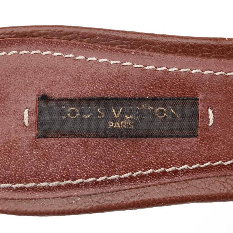 LOUIS VUITTON, a pair of brown leather slip in shoes.