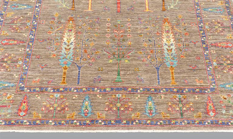 A rug, Ziegler design figural, ca 241 x 169 cm.