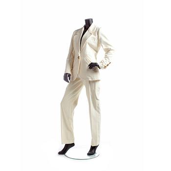 YVES SAINT LAURENT, a two-piece white suit consisting of jacket and trousers.