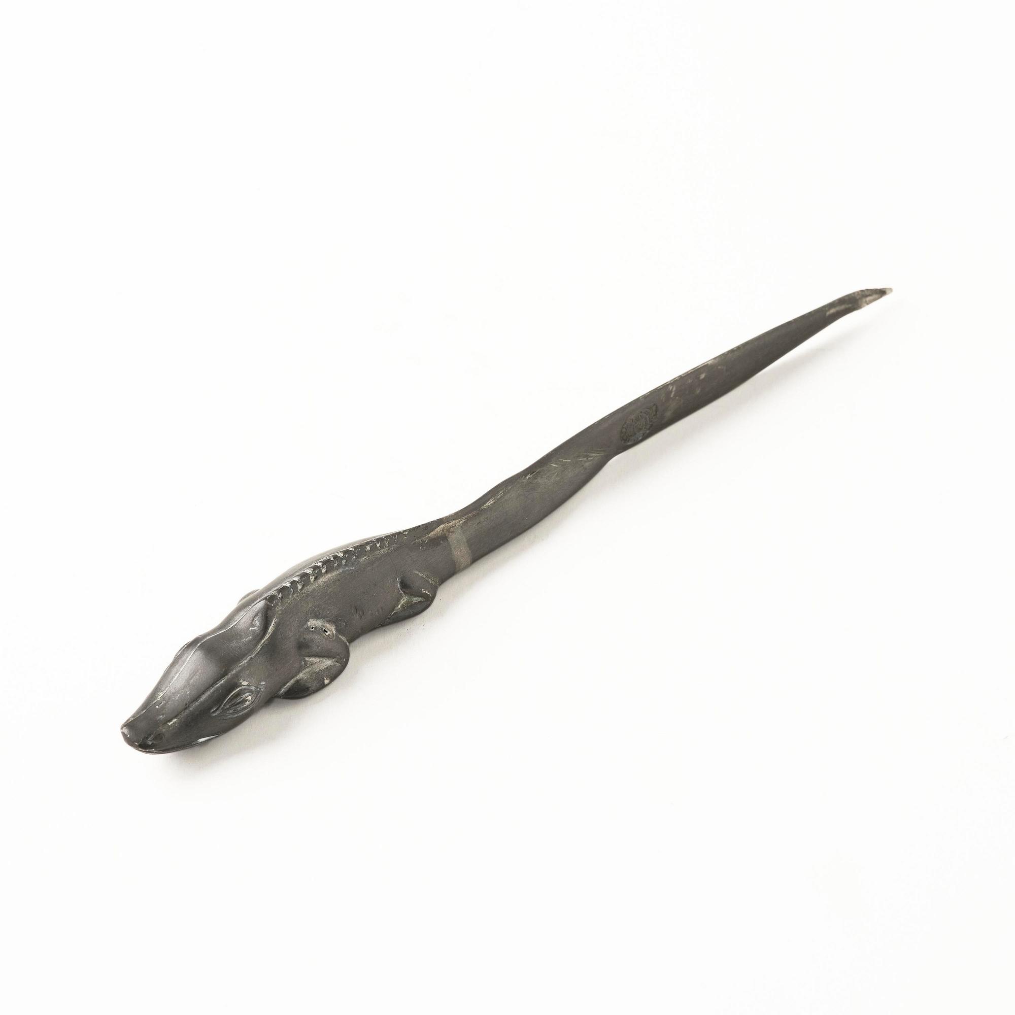 Firma Svenskt Tenn, a pewter hand mirror model A 1497 and a letter opener in the shape of an alligator, Stockholm, 1930s-40s.