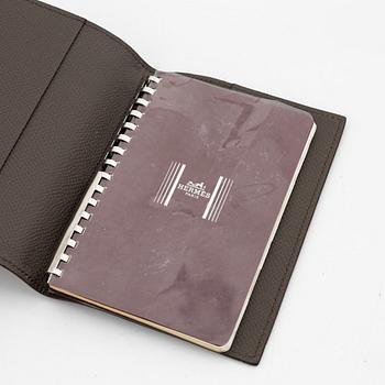 Hermès, notebook with leather case.