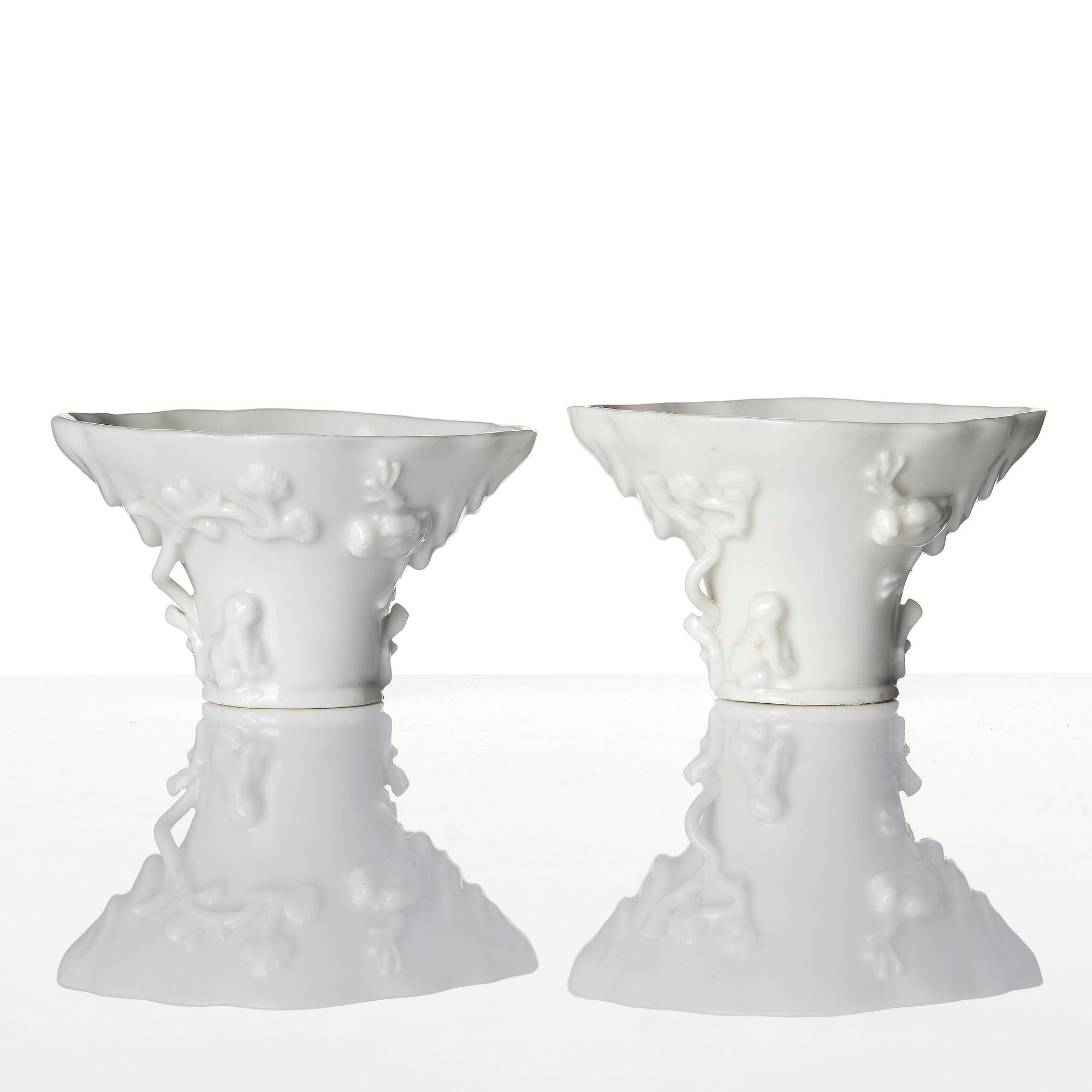 Two blanc de chine rhinoceros libation cups, Qing dynasty, Kangxi (1662-1722).