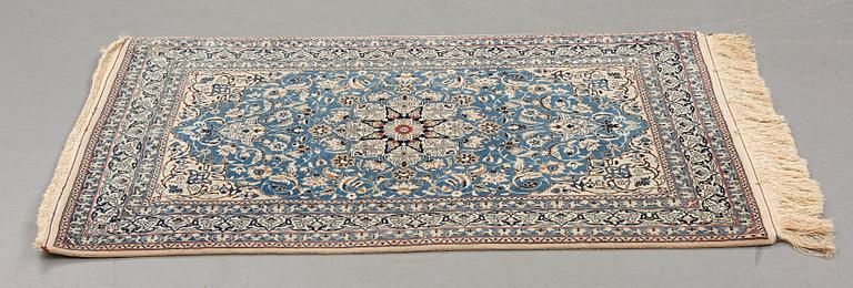 A rug, semi-antique Nain, part silk, ca 122,5 x 80 cm (as well as 1,5 cm flat weave at the ends).