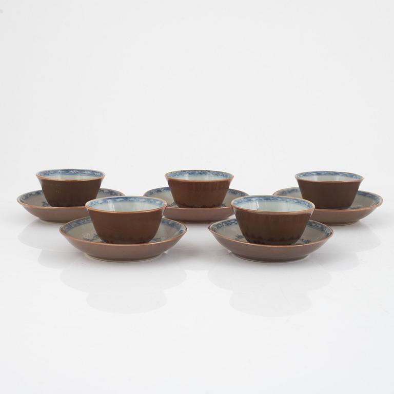 Three Kangxi cups with saucers and five Qianlong cups with saucers, China, 18th century.