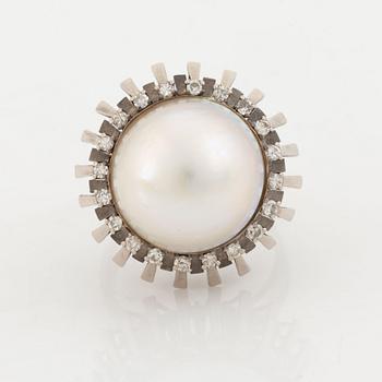 A pearl and diamond ring.
