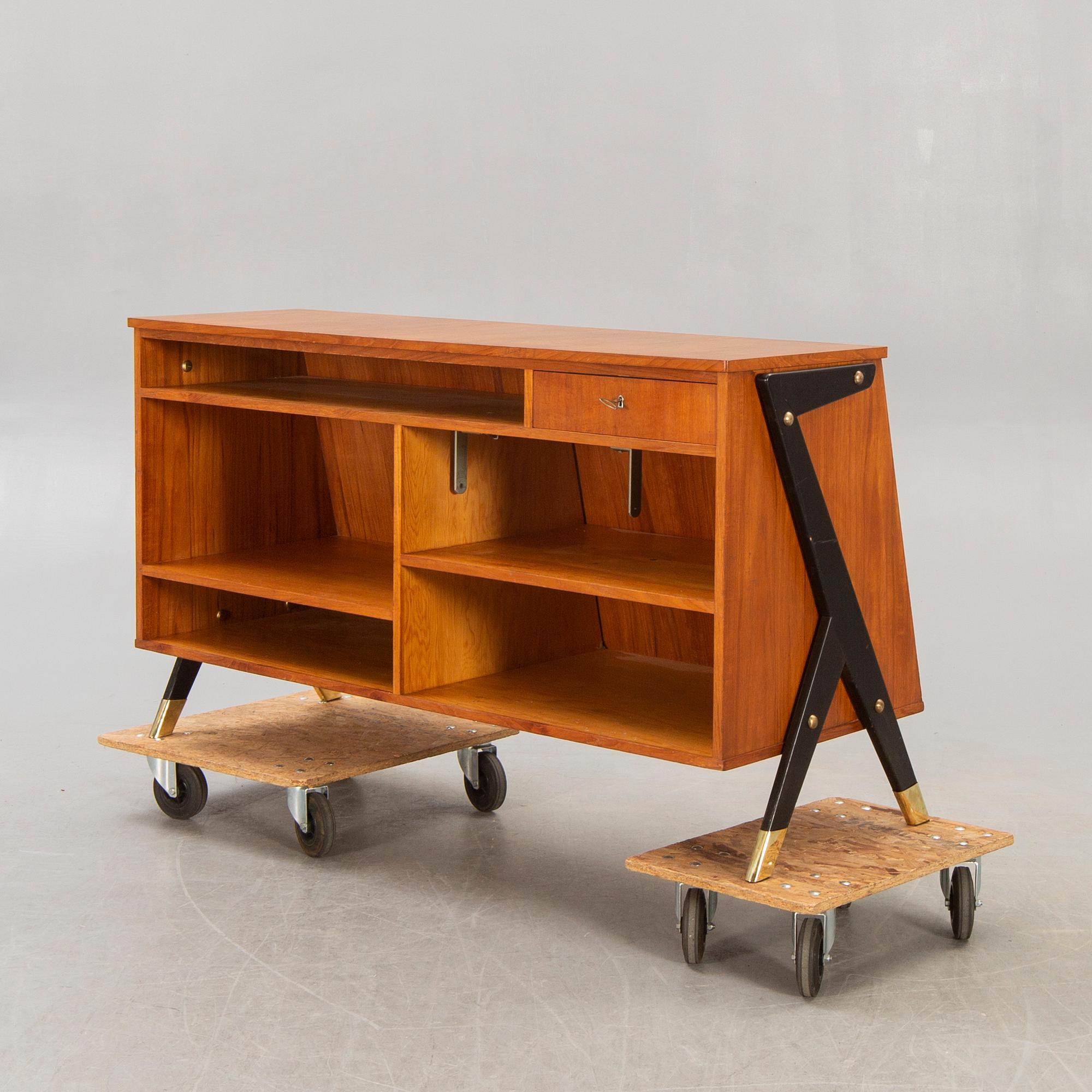 A mid 1900s teak counter.
