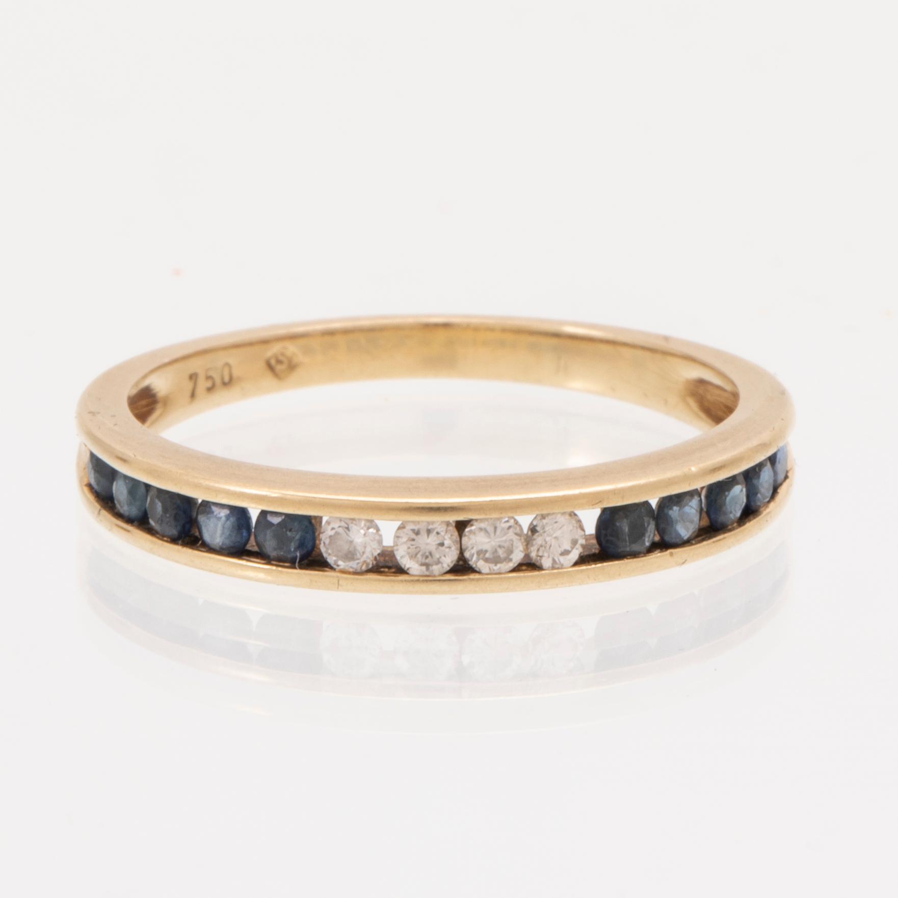 An 18K gold ring and a pair of earrings by H. Stern set with round brilliant cut diamonds and sapphires.